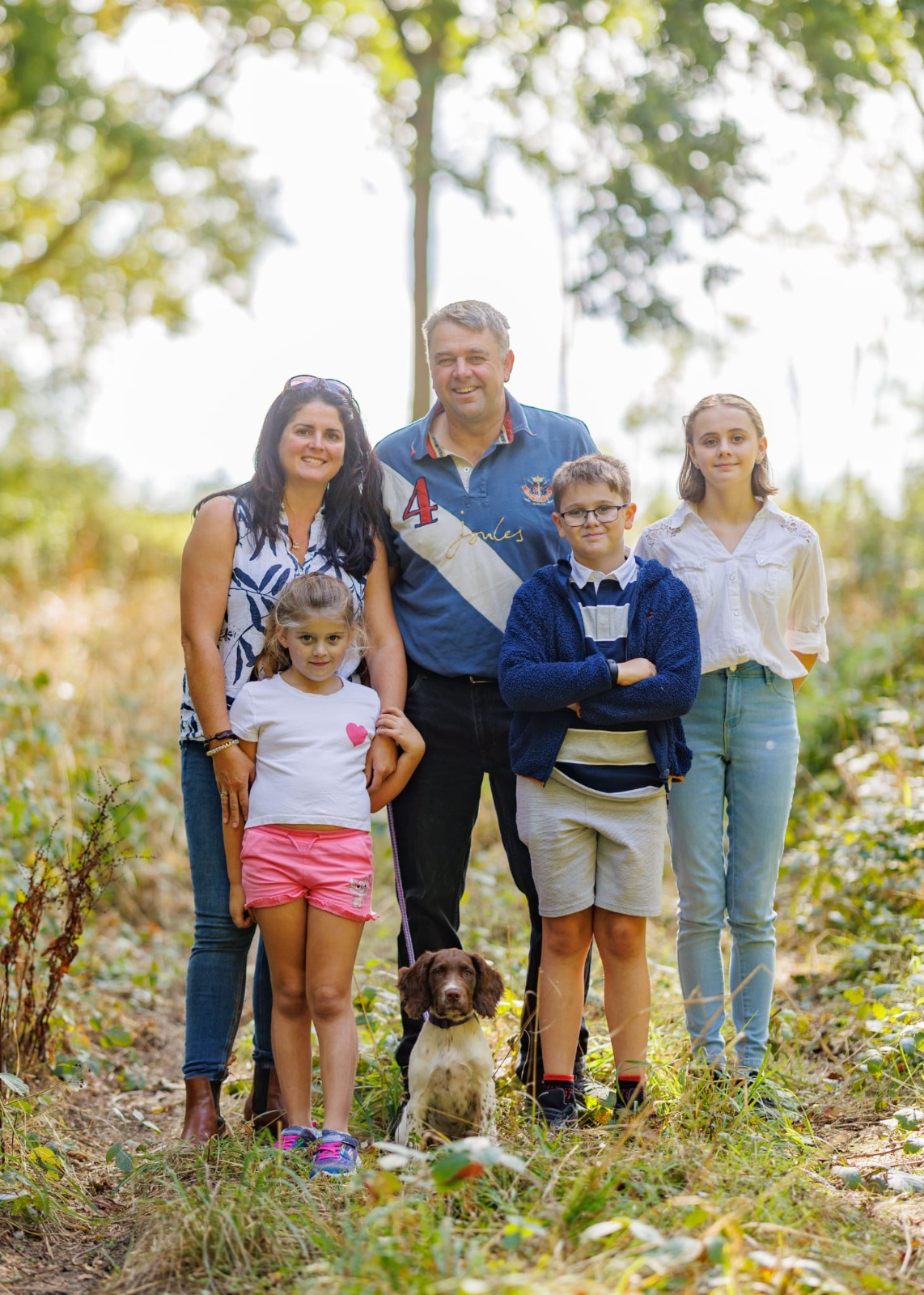 Leigh, Donya and the children in the woods at Peacock Farm
